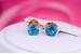 Сережки гвоздики Xuping Jewelry з блакитним каменем чотири кріплення 7 мм золотисті