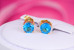 Сережки гвоздики Xuping Jewelry з блакитним каменем чотири кріплення 7 мм золотисті