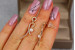 Сережки гвоздики Xuping Jewelry пташка з перлиною 3 см золотисті