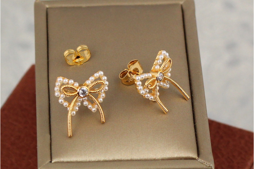 Сережки гвоздики Xuping Jewelry перлинні бантики 1.8 см золотисті
