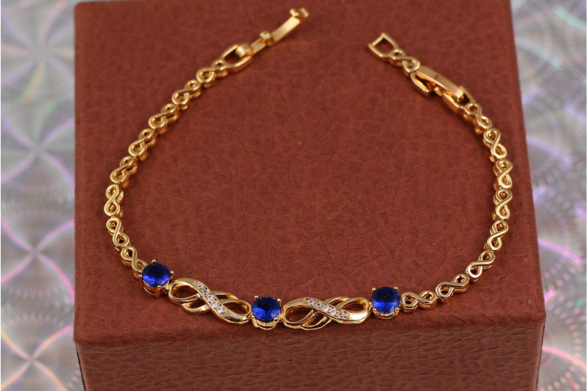 Браслет Xuping Jewelry вісімки з трьома круглими синіми каменями в центрі 17 см 6 мм золотистий