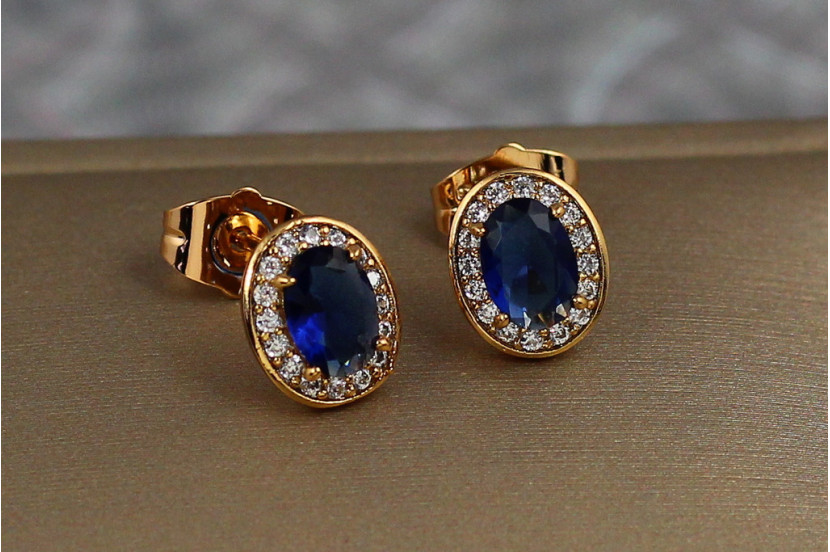Сережки гвоздики Xuping Jewelry овальні малинки із синіми каменями 10 мм золотисті