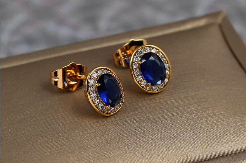 Сережки гвоздики Xuping Jewelry овальні малинки із синіми каменями 10 мм золотисті