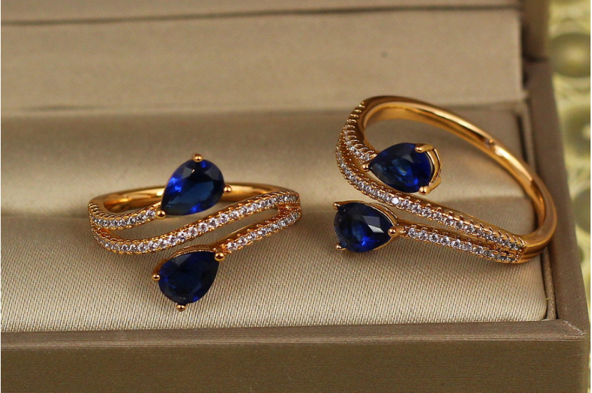 Кільце Xuping Jewelry зустрічні краплі із синіми каменями р 20 золотисте