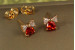 Сережки гвоздики Xuping Jewelry серце з бантиком із червоним каменем 7 мм золотисті
